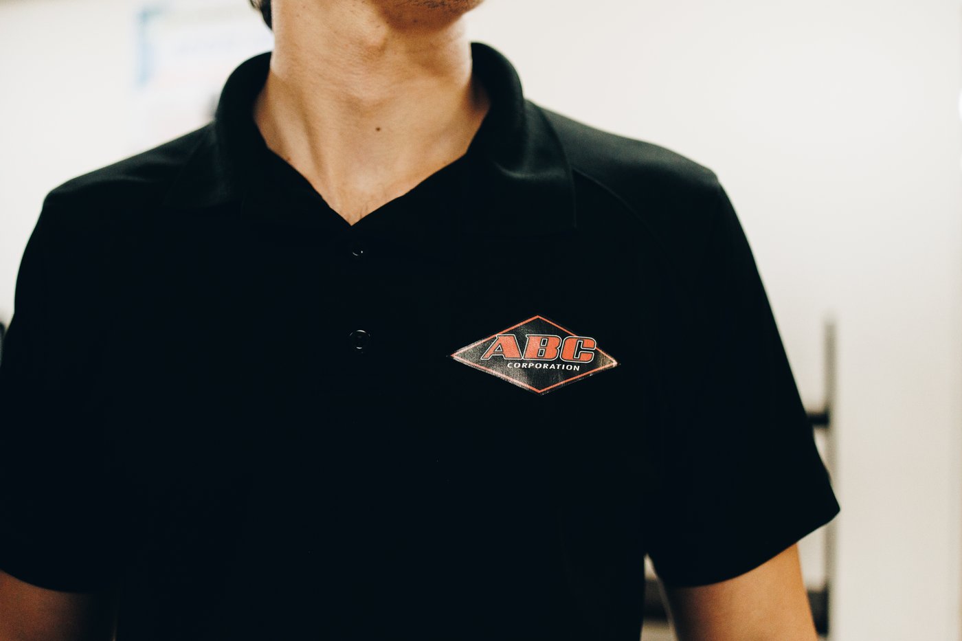 ABC Corporation logo on a team polo shirt